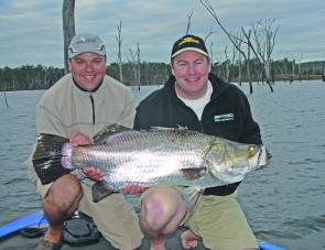 Trent Butler and Jason pose with Trent’s 104cm barra before release. Barra over a metre are sheer magic.